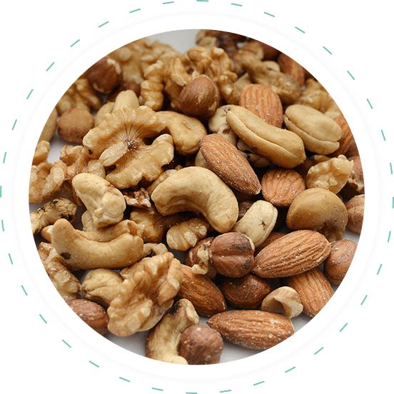 A white plate topped with nuts and almonds.